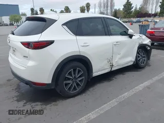 2018 Mazda CX-5 Grand Touring with VIN JM3KFADM1J0309995, listed as a IAAI auction lot 41977003 with 75,303 mi miles. Bid and sale history available at carsss.com. Image 4.