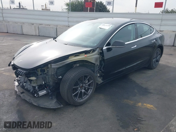 2020 Tesla Model 3 Long Range z VIN 5YJ3E1EB0LF600098, wystawiony jako IAAI lot #41071258 z przebiegiem 149 939 mil mil oraz . Historia ofert i sprzedaży dostępna na DreamBid. Obrazek 2.