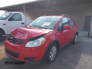 2010 Suzuki SX4 with VIN JS2YB5A34A6301801, listed as a IAAI auction lot 41884838 with 124,381 mi miles. Bid and sale history available at carsss.com. Image 2.