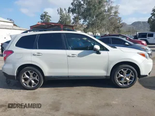 2016 Subaru Forester Touring with VIN JF2SJAXC7GH565287, listed as a IAAI auction lot 41947083 with 126,563 mi miles and . Bid and sale history available at DreamBid. Image 13.
