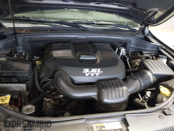 2014 Jeep Grand Cherokee Laredo with VIN 1C4RJEAG7EC145023, listed as a IAAI auction lot 40518825 with 115,098 mi miles and . Bid and sale history available at DreamBid. Image 10.