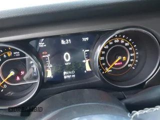 2020 Jeep Gladiator Sport S z VIN 1C6HJTAG5LL141251, wystawiony jako IAAI lot #41825062 z przebiegiem 51 961 mil mil oraz . Historia ofert i sprzedaży dostępna na DreamBid. Obrazek 7.