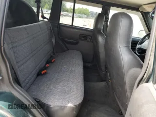 1999 Jeep Cherokee Sport with VIN 1J4FF68S2XL570795, listed as a Copart auction lot 61860585 with 320,467 mi miles and Salvage title. Bid and sale history available at DreamBid. Image 11.