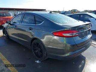 2018 Ford Fusion SE z VIN 3FA6P0H70JR191384, wystawiony jako IAAI lot #41340319 z przebiegiem 89 581 mil mil oraz . Historia ofert i sprzedaży dostępna na DreamBid. Obrazek 3.