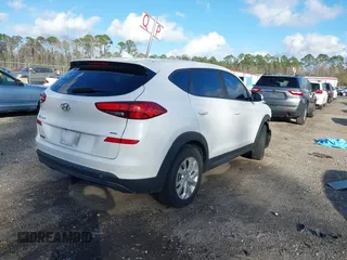 2019 Hyundai Tucson SE with VIN KM8J2CA48KU951829, listed as a IAAI auction lot 41261166 with 100,533 mi miles. Bid and sale history available at carsss.com. Image 4.