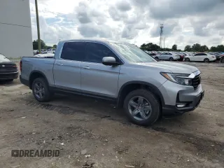 2023 Honda Ridgeline RTL-E with VIN 5FPYK3F70PB018858, listed as a Copart auction lot 64210205 with 16,562 mi miles and Salvage title. Bid and sale history available at DreamBid. Image 4.