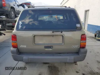 1996 Jeep Grand Cherokee Laredo with VIN 1J4GZ58S3TC245928, listed as a Copart auction lot 57313735 with 165,733 mi miles and Salvage title. Bid and sale history available at DreamBid. Image 6.