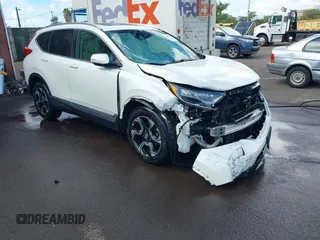 2018 Honda CR-V Touring with VIN 2HKRW1H96JH506435, listed as a IAAI auction lot 41228873 with 11,585 mi miles and . Bid and sale history available at carsss.com. Image 1.