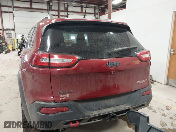 2015 Jeep Cherokee Trailhawk with VIN 1C4PJMBS7FW646577, listed as a IAAI auction lot 41404911 with 85,343 mi miles and . Bid and sale history available at DreamBid. Image 16.