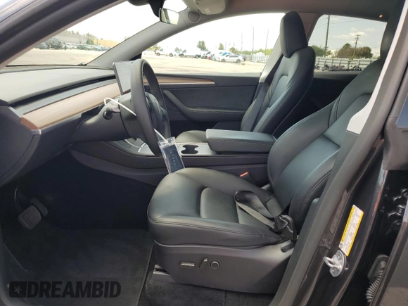 2025 Tesla Model Y Long Range with VIN 7SAYGDED8SF241779, listed as a Copart auction lot 51899205 with 12,409 mi miles and Salvage Title. Bid and sale history available at DreamBid. Image 7.