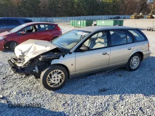1999 Saturn SW z VIN 1G8ZK8277XZ162136, wystawiony jako Copart lot #83206604 z przebiegiem Nie podano mil oraz Szkody całkowita. Historia ofert i sprzedaży dostępna na DreamBid. Obrazek 1.