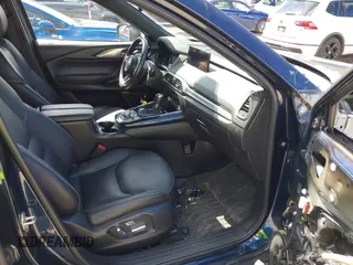 2021 Mazda CX-9 Grand Touring with VIN JM3TCBDY4M0513099, listed as a IAAI auction lot 42563530 with 76,006 mi miles and . Bid and sale history available at DreamBid. Image 5.