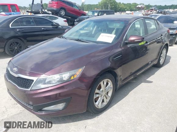 2013 Kia Optima EX with VIN 5XXGN4A7XDG177274, listed as a IAAI auction lot 42759090 with 164,212 mi miles and . Bid and sale history available at DreamBid. Image 2.