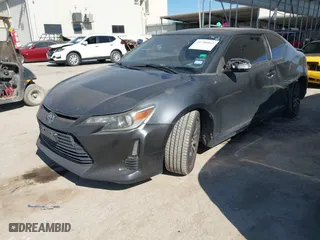 2014 Scion tC with VIN JTKJF5C74E3085237, listed as a IAAI auction lot 41788862 with 106,807 mi miles. Bid and sale history available at carsss.com. Image 2.