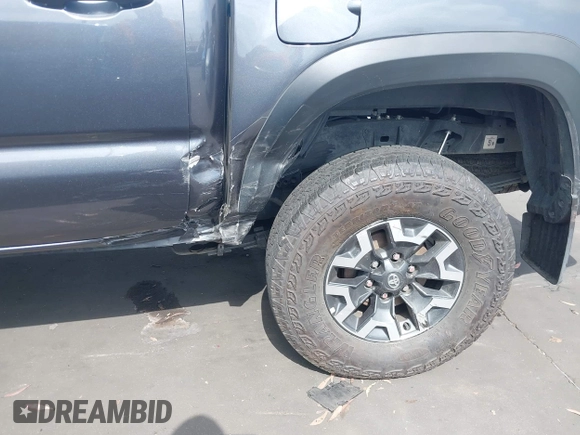 2023 Toyota Tacoma SR with VIN 3TMCZ5AN0PM635933, listed as a IAAI auction lot 42543126 with 32,960 mi miles and . Bid and sale history available at DreamBid. Image 6.