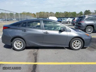 2021 Toyota Prius L Eco with VIN JTDKAMFU4M3134778, listed as a IAAI auction lot 41843429 with 145,757 mi miles. Bid and sale history available at carsss.com. Image 13.