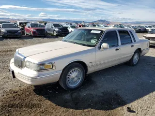 1997 Lincoln Town Car Cartier with VIN 1LNLM83W8VY738956, listed as a Copart auction lot 72179584 with 167,987 mi miles and Clean title. Bid and sale history available at DreamBid. Image 1.