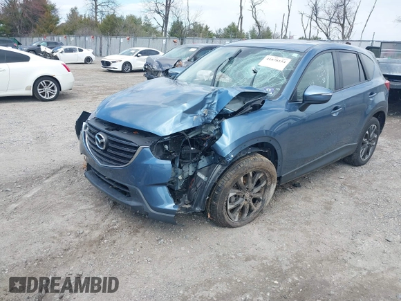 2016 Mazda CX-5 Grand Touring with VIN JM3KE4DY0G0629924, listed as a IAAI auction lot 41878154 with 78,196 mi miles. Bid and sale history available at carsss.com. Image 20.