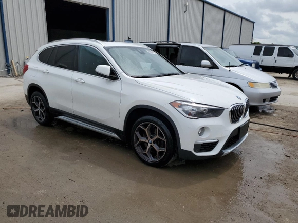 2019 BMW X1 sDrive28i with VIN WBXHU7C57K5L10243, listed as a Copart auction lot 48959423 with 42,248 mi miles and . Bid and sale history available at DreamBid. Image 4.