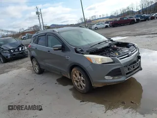 2014 Ford Escape Titanium with VIN 1FMCU9J97EUD26523, listed as a IAAI auction lot 41919727 with 185,907 mi miles. Bid and sale history available at carsss.com. Image 1.