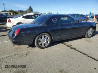 2004 Ford Thunderbird Deluxe with VIN 1FAHP60A94Y105675, listed as a Copart auction lot 87677015 with 91,154 mi miles and Salvage Title. Bid and sale history available at DreamBid. Image 3.