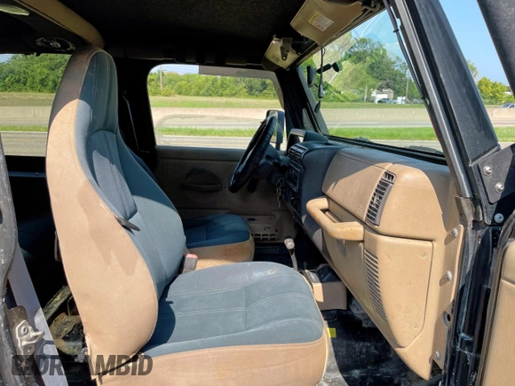 1999 Jeep Wrangler Sahara with VIN 1J4FY49S5XP496486, listed as a Copart auction lot 54989365 with 128,498 mi miles and Clean Title. Bid and sale history available at carsss.com. Image 5.