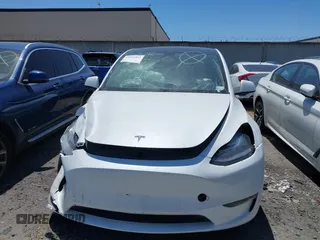 2022 Tesla Model Y Long Range with VIN 7SAYGDEE8NF480939, listed as a IAAI auction lot 41808863 with 62,607 mi miles and . Bid and sale history available at carsss.com. Image 13.