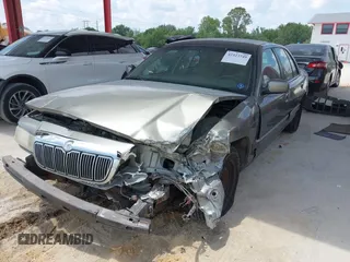 2001 Mercury Grand Marquis GS z VIN 2MEFM74W41X702619, wystawiony jako IAAI lot #42323749 z przebiegiem 124 748 mil mil oraz . Historia ofert i sprzedaży dostępna na DreamBid. Obrazek 2.