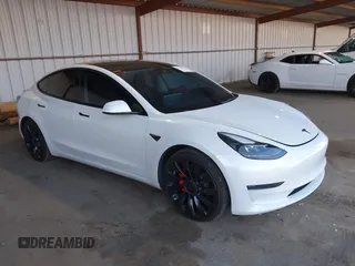 2021 Tesla Model 3 Performance with VIN 5YJ3E1EC4MF097993, listed as a IAAI auction lot 41366615 with 30,735 mi miles and . Bid and sale history available at DreamBid. Image 1.