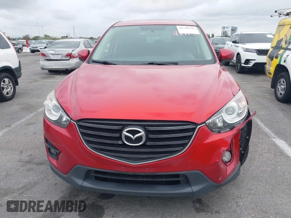 2016 Mazda CX-5 Touring with VIN JM3KE2CY3G0877185, listed as a IAAI auction lot 41729243 with 144,656 mi miles. Bid and sale history available at carsss.com. Image 12.