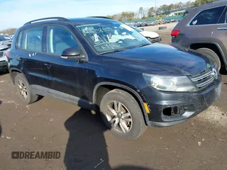 2015 Volkswagen Tiguan SE with VIN WVGAV7AX2FW593453, listed as a IAAI auction lot 41658359 with 159,619 mi miles and . Bid and sale history available at DreamBid. Image 1.
