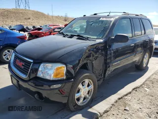 2005 GMC Envoy SLE with VIN 1GKDT13S752390266, listed as a Copart auction lot 50766935 with 115,225 mi miles and Salvage Title. Bid and sale history available at carsss.com. Image 1.
