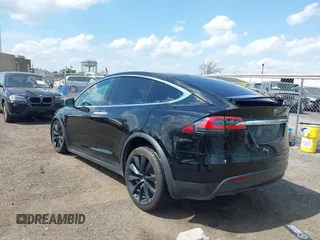 2019 Tesla Model X 75D with VIN 5YJXCBE21KF180203, listed as a IAAI auction lot 42190255 with 114,294 mi miles and . Bid and sale history available at carsss.com. Image 3.