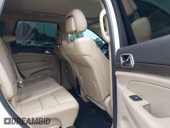 2018 Jeep Grand Cherokee Sterling with VIN 1C4RJEBG8JC289169, listed as a IAAI auction lot 42267113 with 77,274 mi miles and . Bid and sale history available at DreamBid. Image 8.