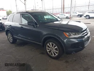 2014 Volkswagen Touareg Sport with VIN WVGEF9BP0ED015273, listed as a IAAI auction lot 42046823 with 84,694 mi miles and . Bid and sale history available at DreamBid. Image 1.