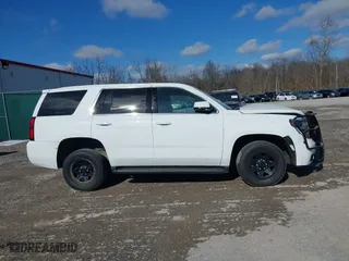 2020 Chevrolet Tahoe Commercial with VIN 1GNSKDEC2LR217697, listed as a IAAI auction lot 40815499 with 128,503 mi miles. Bid and sale history available at carsss.com. Image 13.