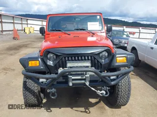 2005 Jeep Wrangler X with VIN 1J4FA39S35P358201, listed as a IAAI auction lot 42080407 with 130,110 mi miles. Bid and sale history available at carsss.com. Image 13.