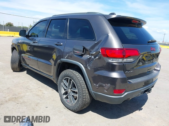 2017 Jeep Grand Cherokee Trailhawk with VIN 1C4RJFLG3HC877110, listed as a IAAI auction lot 42276506 with 144,993 mi miles and . Bid and sale history available at DreamBid. Image 3.