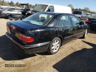 2001 Mercedes-Benz E-Class with VIN WDBJF65J01B325792, listed as a Copart auction lot 76328704 with 101,886 mi miles and Salvage Title. Bid and sale history available at carsss.com. Image 3.