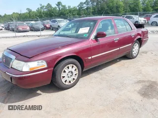 2005 Mercury Grand Marquis GS z VIN 2MEFM74W05X641274, wystawiony jako IAAI lot #42298098 z przebiegiem 159 424 mil mil oraz . Historia ofert i sprzedaży dostępna na DreamBid. Obrazek 2.