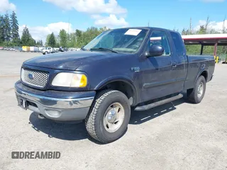 2001 Ford F-150 XL with VIN 1FTRX18L11NA30541, listed as a IAAI auction lot 42143117 with 187,855 mi miles. Bid and sale history available at carsss.com. Image 2.