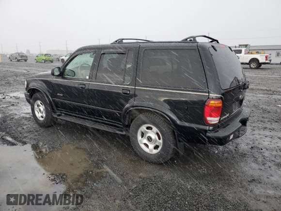 2000 Ford Explorer Limited with VIN 1FMDU75EXYZA76329, listed as a Copart auction lot 80952474 with 90,637 mi miles and Salvage title. Bid and sale history available at DreamBid. Image 2.