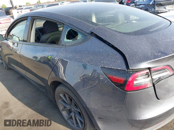 2023 Tesla Model 3 with VIN 5YJ3E1EA4PF427022, listed as a IAAI auction lot 42465964 with 169,346 mi miles and . Bid and sale history available at DreamBid. Image 6.