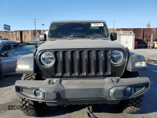2020 Jeep Wrangler Unlimited Willys with VIN 1C4HJXDG5LW348507, listed as a Copart auction lot 77000574 with 57,056 mi miles and Salvage title. Bid and sale history available at DreamBid. Image 5.