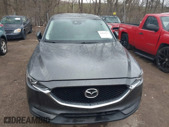 2017 Mazda CX-5 Touring with VIN JM3KFACL3H0148312, listed as a IAAI auction lot 41844634 with 68,534 mi miles and . Bid and sale history available at carsss.com. Image 6.