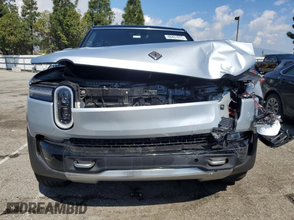 2025 Rivian R1S Adventure z VIN 7PDSGBBA2SN052590, wystawiony jako Copart lot #48431075 z przebiegiem 11 065 mil mil oraz Szkody całkowita. Historia ofert i sprzedaży dostępna na DreamBid. Obrazek 5.