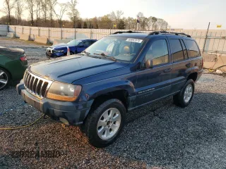 2001 Jeep Grand Cherokee Laredo with VIN 1J4GW48N01C673272, listed as a Copart auction lot 50892975 with 236,815 mi miles and Salvage title. Bid and sale history available at DreamBid. Image 1.