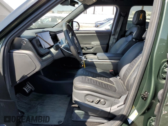 2023 Rivian R1T Adventure z VIN 7FCTGAAA9PN018171, wystawiony jako Copart lot #72593614 z przebiegiem 12 553 mil mil oraz Szkody całkowita. Historia ofert i sprzedaży dostępna na DreamBid. Obrazek 7.
