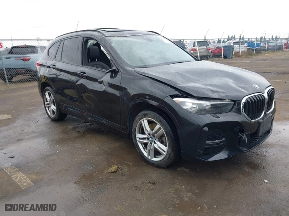 2021 BMW X1 xDrive28i with VIN WBXJG9C01M3M71033, listed as a IAAI auction lot 41723970 with 71,000 mi miles. Bid and sale history available at carsss.com. Image 1.