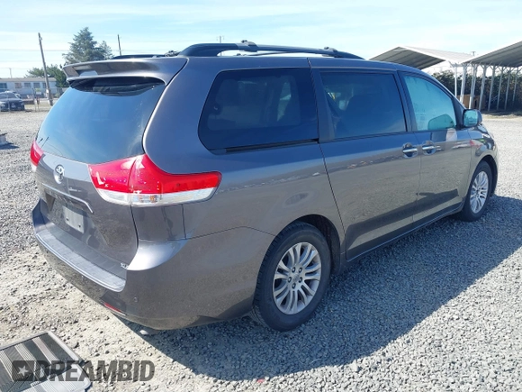 2014 Toyota Sienna XLE with VIN 5TDYK3DC5ES451965, listed as a IAAI auction lot 41879334 with 145,114 mi miles and . Bid and sale history available at DreamBid. Image 4.